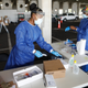 Registered nurses Gina Aubourg (L) and Renee Lewis begin testing at the COVID-19 drive-thru testing site at the Duke Energy for the Arts Mahaffey Theater on July 8, 2020, in St. Petersburg, Fla.